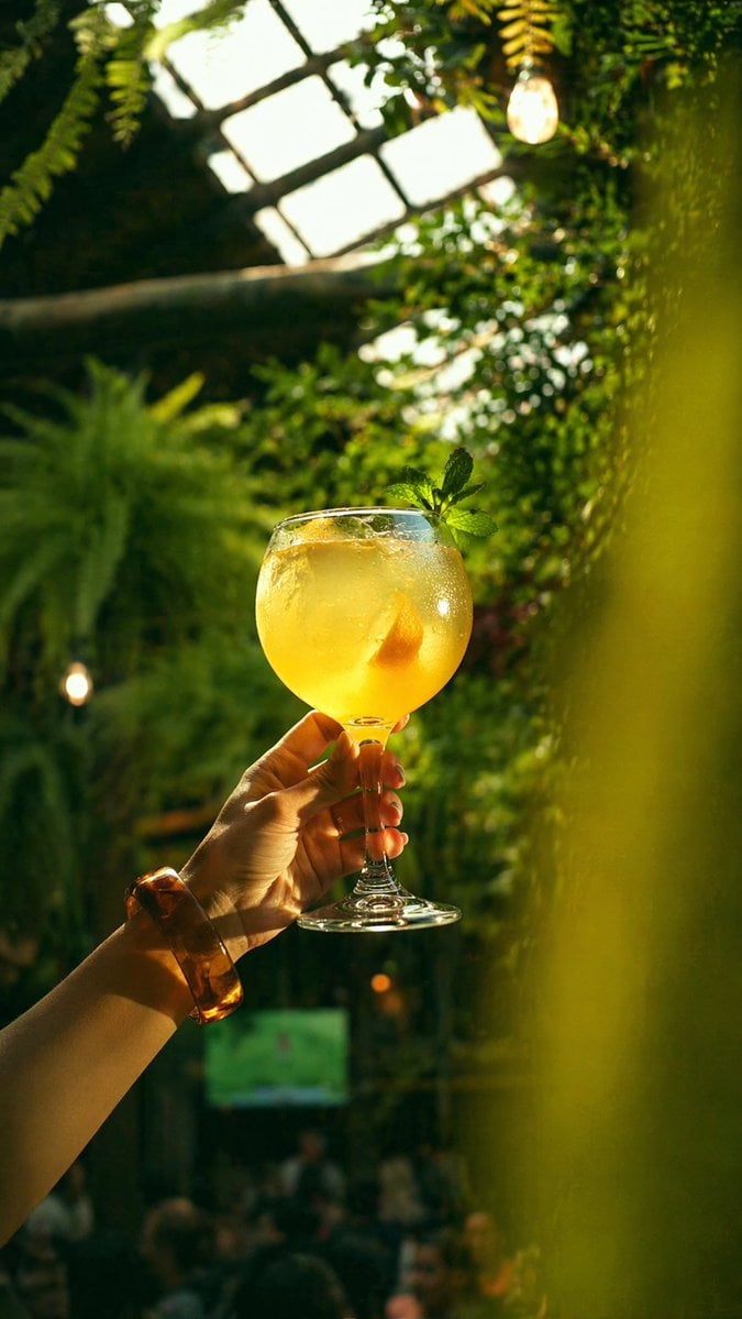 Gpt2 Social Media Post Golden Cocktail in Greenhouse Bar