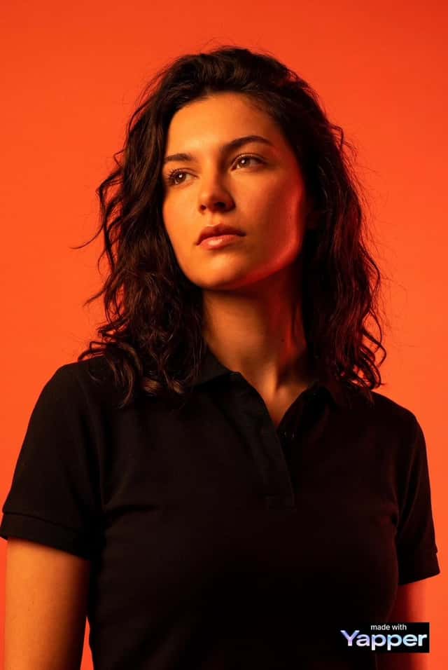 High-impact editorial studio portrait using the person from the attached preview