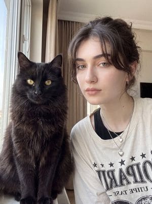 AI-generated sample for “Woman with Fluffy Black Cat Portrait”