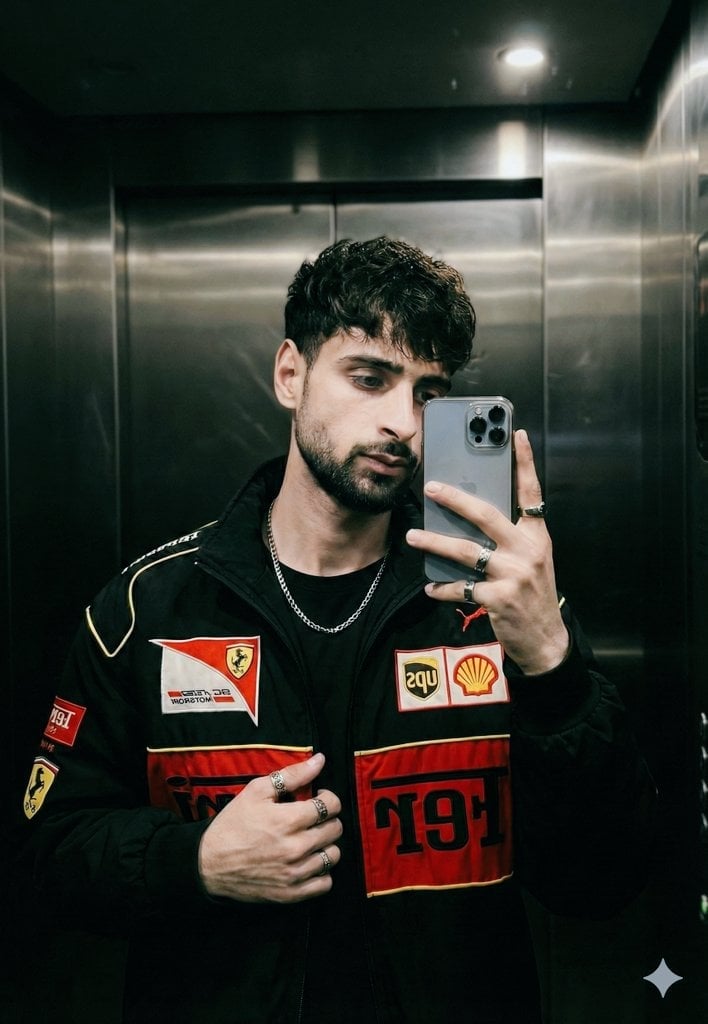Cinematic mirror selfie in a stainless-steel elevator