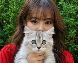 Woman with Kitten Close-up