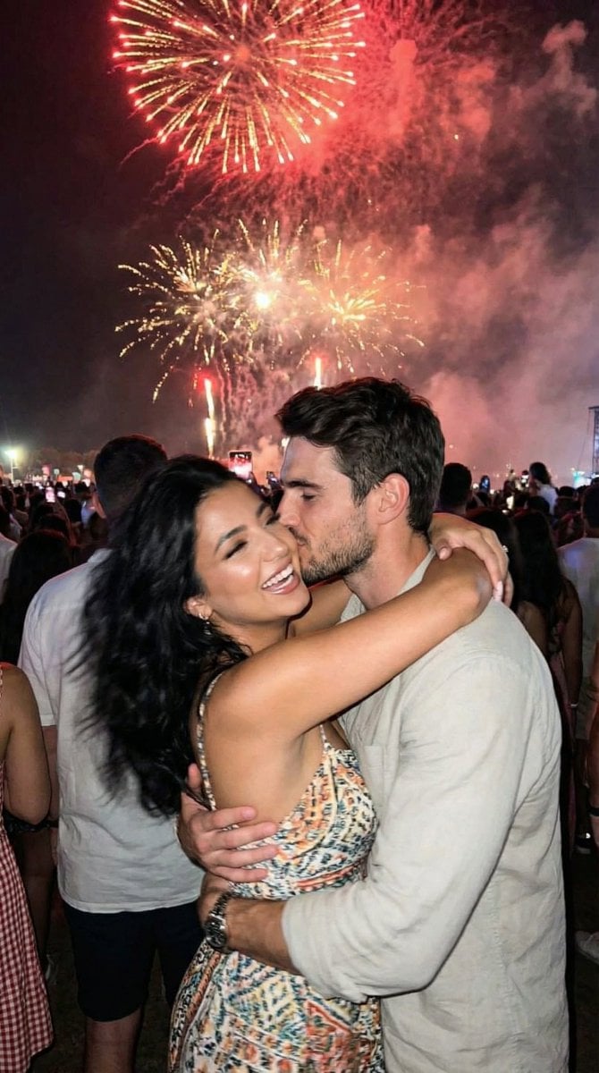 Candid Smartphone Snapshot of Festival Kiss with Fireworks