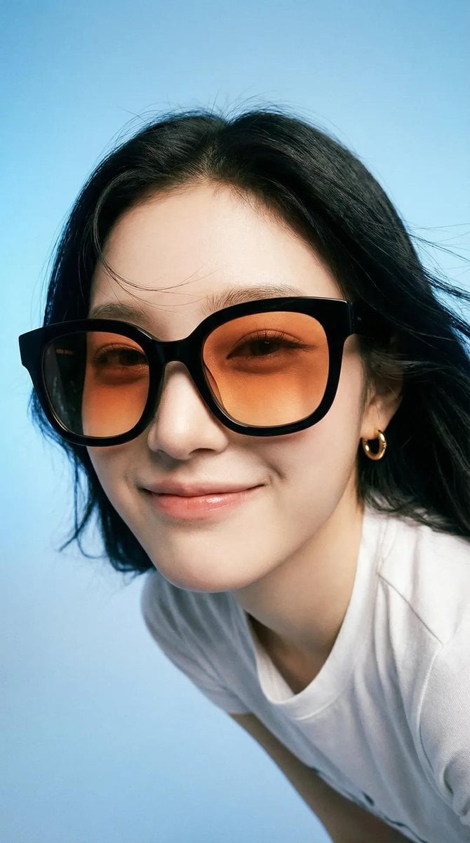 Photorealistic editorial portrait of a smiling woman using the exact
