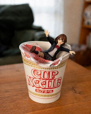 Anime Figurine Falling Into Cup Noodle