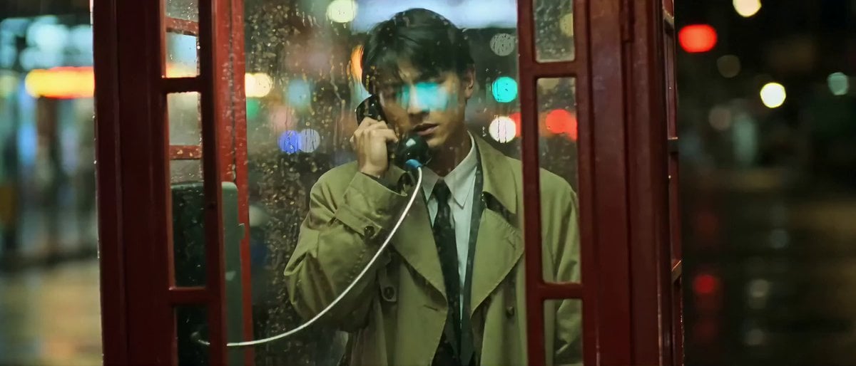 Wong Kar-wai style rainy phone booth scene